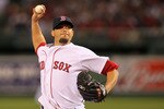 BOSTON - APRIL 04: Josh Beckett #19 of the Boston Red Sox pitches in the second inning against the New York Yankees on Opening Night at Fenway Park on April 4, 2010 in Boston, Massachusetts. (Photo by Jim Rogash/Getty Images)