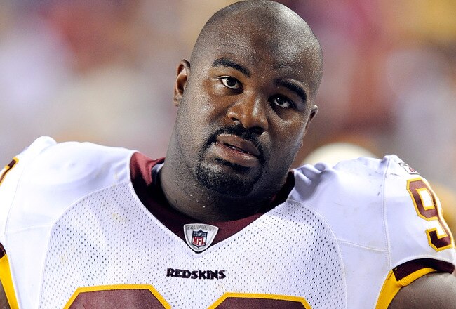 LANDOVER, MD - AUGUST 22:  Albert Haynesworth #92 of the Washington Redskins watches the game against the Pittsburgh Steelers at Fed Ex Field on August 22, 2009 in Landover, Maryland.  (Photo by Greg Fiume/Getty Images)