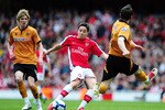 LONDON, ENGLAND - APRIL 03:  Samir Nasri of Arsenal is challenged by Stephen Ward of Wolverhampton Wanderers during the Barclays Premier League match between Arsenal and Wolverhampton Wanderers at the Emirates Stadium on April 3, 2010 in London, England.  (Photo by Mike Hewitt/Getty Images)