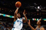 NEW ORLEANS - MARCH 31:  (EDITORS NOTE: Image was created using a variable planed lens) Chris Paul #3 of the New Orleans Hornets shoots the ball over Shaun Livingston #2 of the Washington Wizards at New Orleans Arena on March 31, 2010 in New Orleans, Louisiana.  The Wizards defeated the Hornets 96-91.  NOTE TO USER: User expressly acknowledges and agrees that, by downloading and/or using this Photograph, User is consenting to the terms and conditions of the Getty Images License Agreement.  (Photo by Chris Graythen/Getty Images)