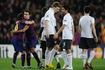 BARCELONA, SPAIN - APRIL 06:  Lionel Messi of Barcelona celebrates as Nicklas Bendtner and Eduardo of Arsenal look dejected after the UEFA Champions League quarter final second leg match between Barcelona and Arsenal at Camp Nou on April 6, 2010 in Barcelona, Spain.  (Photo by Jasper Juinen/Getty Images)