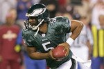 LANDOVER, MD - NOVEMBER 6:  Donvan McNabb #5 of the Philadelphia Eagles runs with the ball during the game against the Washington Redskins on November 6, 2005 at Fed Ex Field in Landover, Maryland.The Redskins defeated the Eagles 17-10.(Photo by Jim McIsaac/Getty Images)                           