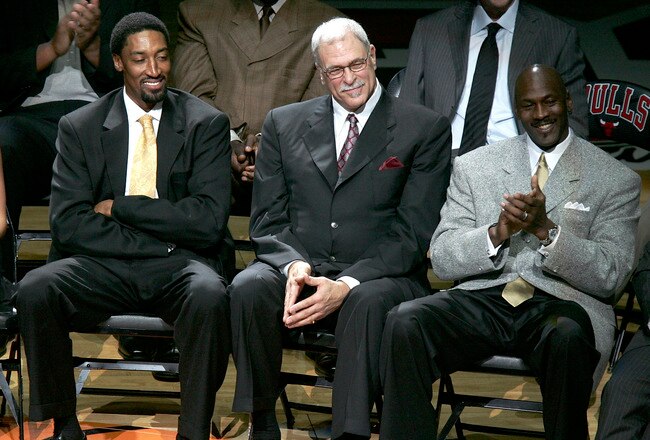 CHICAGO - DECEMBER 9:  (L-R) Scottie Pippen, Phil Jackson and Michael Jordan, formerly of the Chicago Bulls, look on during a ceremony retiring Pippen's #33 at halftime of a game between the Bulls and the Los Angeles Lakers on December 9, 2005 at the United Center in Chicago, Illinois.  NOTE TO USER: User expressly acknowledges and agreees that, by downloading and/or using this Photograph, User is consenting to the terms and conditions of the Getty Images License Agreement. (Photo by Jonathan Daniel/Getty Images)