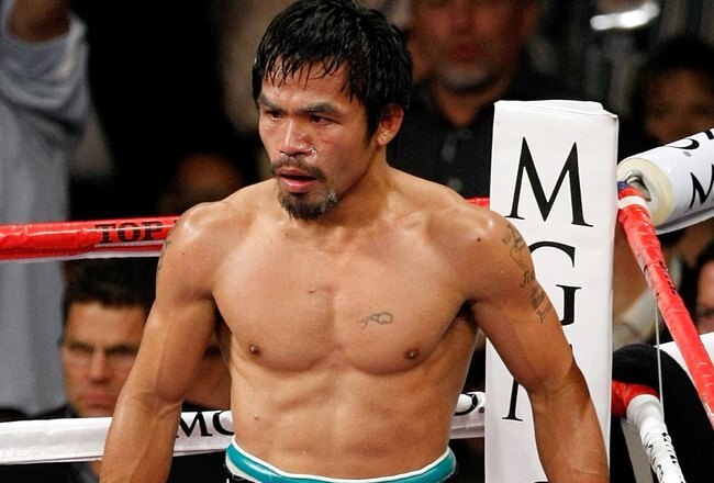 LAS VEGAS - NOVEMBER 14:  Manny Pacquiao stands in a neutral corner after knocking Miguel Cotto down in the third round during their WBO welterweight title fight at the MGM Grand Garden Arena on November 14, 2009 in Las Vegas, Nevada. Pacquiao defeated Cotto by TKO in the 12th round.  (Photo by Ethan Miller/Getty Images)