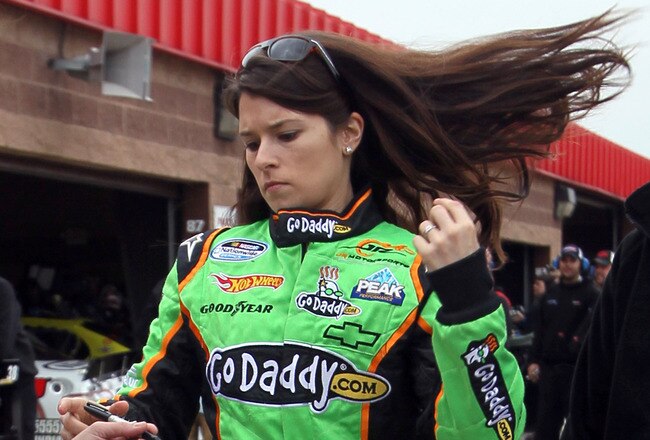 FONTANA, CA - FEBRUARY 19:  Danica Patrick, driver of the #7 GoDaddy.com Chevrolet, walks in the garage area during practice for the NASCAR Nationwide Series Stater Bros. 300 at Auto Club Speedway on February 19, 2010 in Fontana, California.  (Photo by Stephen Dunn/Getty Images for NASCAR)