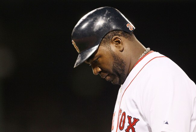 BOSTON - APRIL 04:  David Ortiz #34 of the Boston Red Sox heads into the dugout against the New York Yankees on April 4, 2010 during Opening Night at Fenway Park in Boston, Massachusetts.  (Photo by Elsa/Getty Images)