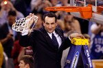 INDIANAPOLIS - APRIL 05:  Head coach Mike Krzyzewski of the Duke Blue Devils celebrates after he cut down a piece of the net following their 61-59 win against the Butler Bulldogs during the 2010 NCAA Division I Men's Basketball National Championship game at Lucas Oil Stadium on April 5, 2010 in Indianapolis, Indiana.  (Photo by Kevin C. Cox/Getty Images)