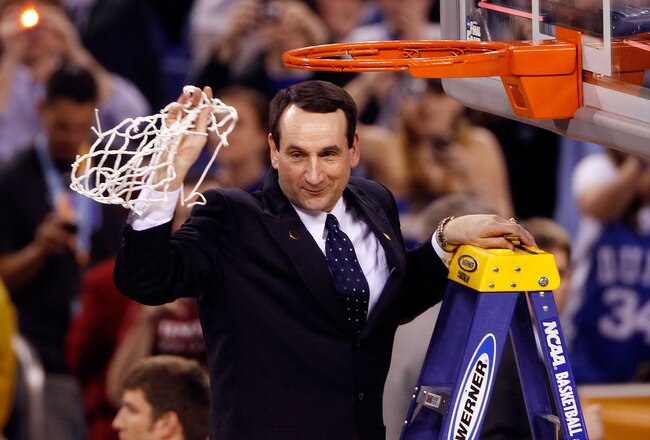 INDIANAPOLIS - APRIL 05:  Head coach Mike Krzyzewski of the Duke Blue Devils celebrates after he cut down a piece of the net following their 61-59 win against the Butler Bulldogs during the 2010 NCAA Division I Men's Basketball National Championship game at Lucas Oil Stadium on April 5, 2010 in Indianapolis, Indiana.  (Photo by Kevin C. Cox/Getty Images)