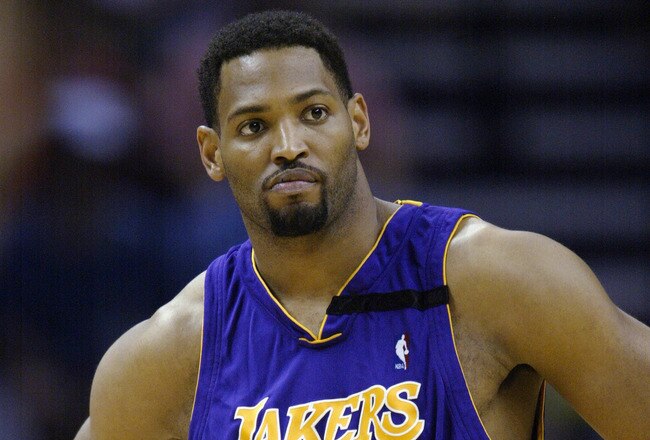 SAN ANTONIO - MAY 7:  Robert Horry #5 of the Los Angeles Lakers watches Game two of the Western Conference Semifinals against the San Antonio Spurs during the 2003 NBA Playoffs at SBC Center on May 7, 2003 in San Antonio, Texas.  The Spurs won 114-95.  NOTE TO USER: User expressly acknowledges and agrees that, by downloading and/or using this Photograph, User is consenting to the terms and conditions of the Getty Images License Agreement. (Photo by: Brian Bahr/Getty Images)
