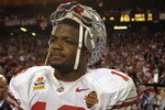 TEMPE, AZ - JANUARY 3:  Freshman running back Maurice Clarett #13 of the Ohio State Buckeyes takes in the BCS Championship victory over the University of Miami Hurricanes in the Tostitos Fiesta Bowl at Sun Devil Stadium on January 3, 2003  in Tempe, Arizona.  Ohio State won the game 31-24 in double-overtime, winning the NCAA National Championship.  (Photo by Brian Bahr/Getty Images)