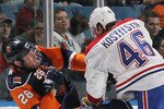 UNIONDALE, NY - APRIL 06: Andrei Kostitsyn #46 of the Montreal Canadiens hits Tim Jackman #28 of the New York Islanders at Nassau Coliseum on April 6, 2010 in Uniondale, New York. The Islanders defeated the Canadiens 4-3 in the shootout. (Photo by Bruce Bennett/Getty Images)
