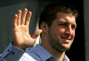 DAYTONA BEACH, FL - FEBRUARY 11:  Quaterback Tim Tebow #7 of the Florida Gators stands onstage before the first NASCAR Sprint Cup Series Gatorade Duel at Daytona International Speedway on February 11, 2010 in Daytona Beach, Florida.  (Photo by Jerry Markland/Getty Images for NASCAR)