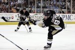 PITTSBURGH, PA - APRIL 6:  Sidney Crosby #87 of the Pittsburgh Penguins follows through on a shot against the Washington Capitals at Mellon Arena on April 6, 2010 in Pittsburgh, Pennsylvania.  The Capitals defeated the Penguins 6-3.  (Photo by Justin K. Aller/Getty Images)
