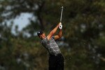 AUGUSTA, GA - APRIL 08:  Tiger Woods hits a shot on the 15th hole during the first round of the 2010 Masters Tournament at Augusta National Golf Club on April 8, 2010 in Augusta, Georgia.  (Photo by Andrew Redington/Getty Images)