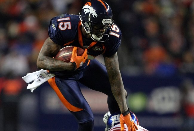 DENVER - NOVEMBER 26:  Wide receiver Brandon Marshall #15 of the Denver Broncos makes a pass reception and is tackled by Terrell Thomas #24 of the New York Giants during NFL action at Invesco Field at Mile High on November 26, 2009 in Denver, Colorado. The Broncos defeated the Giants 26-6. (Photo by Doug Pensinger/Getty Images)