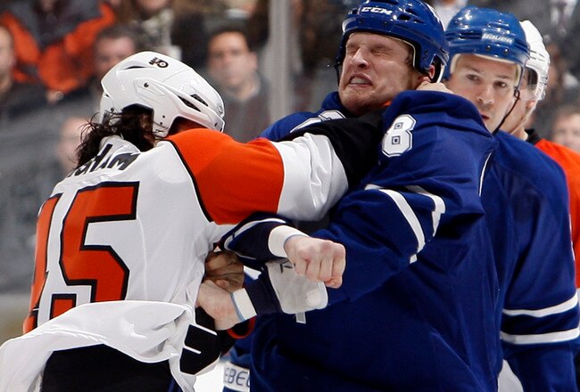 TORONTO - APRIL 6: Colton Orr #28 of the Toronto Maple Leafs fights Arron Asham #45 of the Philadelphia Flyers during an NHL game at the Air Canada Centre April 6, 2010 in Toronto, Ontario, Canada. (Photo by Abelimages/Getty Images)