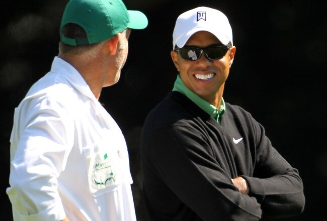 AUGUSTA, GA - APRIL 09:  Tiger Woods (R) smiles as he talks to caddie Steve Williams on the fairway of the second hole during the second round of the 2010 Masters Tournament at Augusta National Golf Club on April 9, 2010 in Augusta, Georgia.  (Photo by Jamie Squire/Getty Images)