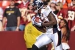 LANDOVER, MD - NOVEMBER 15:  Brandon Marshall #15 of the Denver Broncos makes a touchdown catch in the first quarter during the game against the Washington Redskins at FedExField on November 15, 2009 in Landover, Maryland. The Redskins won 27-17. (Photo by Larry French/Getty Images)