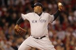 BOSTON - APRIL 04:  CC Sabathia #52 of the New York Yankees deliver a pitch against the Boston Red Sox on April 4, 2010 during Opening Night at Fenway Park in Boston, Massachusetts.  (Photo by Elsa/Getty Images)