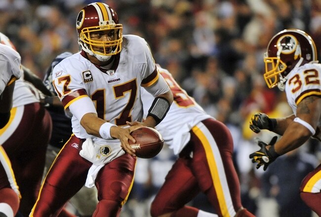 LANDOVER, MD - DECEMBER 21: Quarterback Jason Campbell #17 of the Washington Redskins looks to hand the ball off to running back Marcus Mason #32 during their game against the Dallas Cowboys at FedEx Field on December 27, 2009 in Landover, Maryland. (Photo by Larry French/Getty Images)