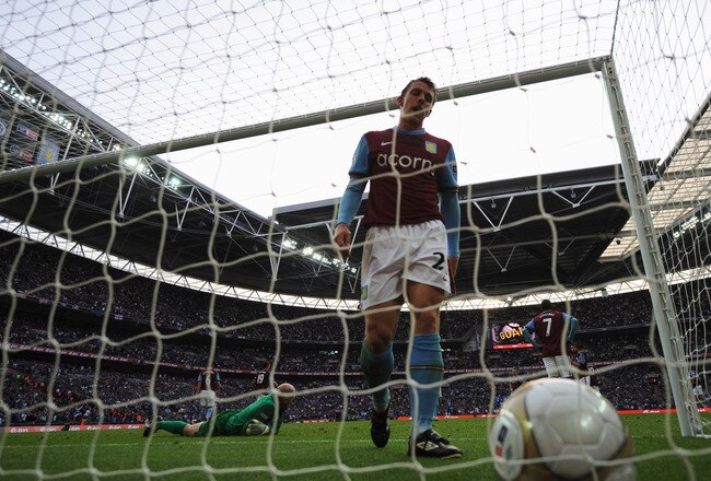 LONDON, ENGLAND - APRIL 10:  Luke Young of Aston Villa is dejected as he goes to pick the ball out of the net during the FA Cup sponsored by E.ON Semi Final match between Aston Villa and Chelsea at Wembley Stadium on April 10, 2010 in London, England.  (Photo by Shaun Botterill/Getty Images)
