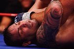 HOLLYWOOD, FL - SEPTEMBER 20:  Ricco Rodriguez of the New York Pit Bulls takes a forarm to the throat by Ben Rothwell of the Quad Cities Silverbacks in their Heavyweight bout during the the International Fight League World Championship Finals on September 19, 2007 at the Hard Rock Hotel and Casino in  Hollywood, Florida  The International Fight League is the worlds first team based professional mixed martial arts league.  In a match, two teams compete against each other with the winning team being the one whose members win three of five one on one matches in five weight divisions.  Competition goes in a round robin format amongst 12 teams with the teams with the two best records ultimately competing for the IFL Championship.  (Photo by Al Bello/Getty Images)