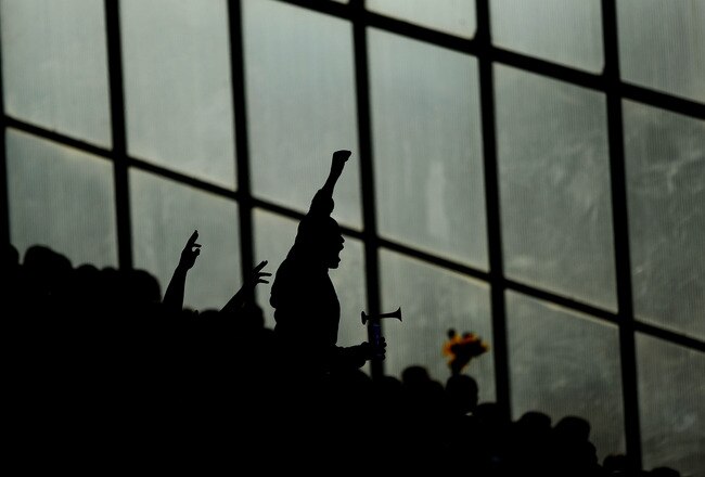 BLACKBURN, ENGLAND - APRIL 11: A Manchester United Fan chants during the Barclays Premier League Match between Blackburn Rovers and Manchester United at Ewood Park on April 11, 2010 in Blackburn, England.  (Photo by Laurence Griffiths/Getty Images)
