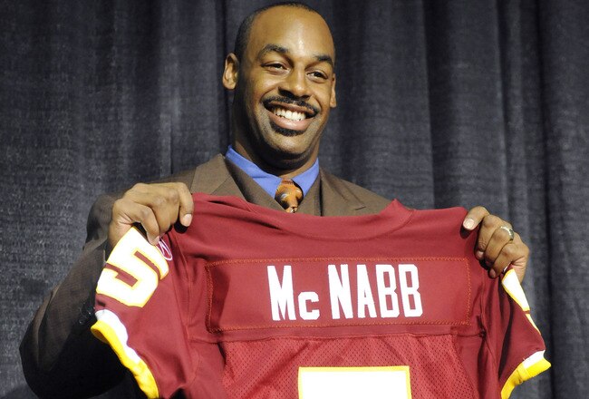 ASHURN, VA - APRIL 6:  Donovan McNabb of the Washington Redskins displays his new jersey during a press conference on April 6, 2010 at Redskin Park in Ashburn, Virginia.  (Photo by Mitchell Layton/Getty Images)