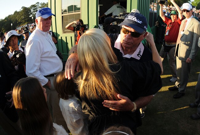 AUGUSTA, GA - APRIL 11:  Swing instructor Butch Harmon congratulates Amy Mickelson on Phil Mickelson's (not pictured) three-stroke victory to win the 2010 Masters Tournament at Augusta National Golf Club on April 11, 2010 in Augusta, Georgia.  (Photo by Harry How/Getty Images)