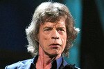 NEW YORK - OCTOBER 30:  Mick Jagger of The Rolling Stones performs onstage with U2 at the 25th Anniversary Rock & Roll Hall of Fame Concert at Madison Square Garden on October 30, 2009 in New York City.  (Photo by Stephen Lovekin/Getty Images)