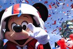 LAKE BUENA VISTA, FL - FEBRUARY 08:  In this handout photo provided by Disney, Super Bowl XLIV MVP Drew Brees joins Mickey Mouse in a celebratory parade in the Magic Kingdom on February 8, 2010 in Lake Buena Vista, Florida.  Brees, the quarterback of the New Orleans Saints, is the latest celebrity to star in the 'I'm Going to Disney World!' and 'I'm Going to Disneyland' commercials which aired only hours after last night's NFL championship game ended.  Brees led his team to a 31-17 victory over the AFC champion Indianapolis Colts in Super Bowl XLIV in Miami.  (Photo by David Roark/Disney via Getty Images)