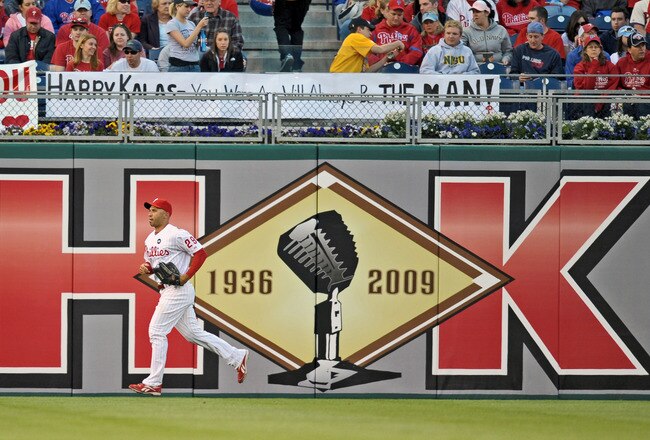 PHILADELPHIA - APRIL 17: Raul Ibanez #29 of the Philadelphia Phillies runs past a sign dedicated to recently departed Philadelphia Phillies announcer Harry Kalas during the game against the San Diego Padres on April 17, 2009 at Citizens Bank Park in Philadelphia, Pennsylvania. Kalas died of a heart attack on April 13, 2009 in Washington, D.C. after falling unconscious in the press box before the Washington Nationals home opener against the Phillies. (Photo by Drew Hallowell/Getty Images)