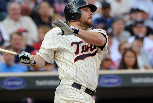 MINNESOTA, MN - APRIL 12: Jason Kubel #16 of the Minnesota Twins hits a solo homerun in the seventh inning against the Boston Red Sox during the Twins home opener at Target Field on April 12, 2010 in Minneapolis, Minnesota. (Photo by Hannah Foslien /Getty Images)