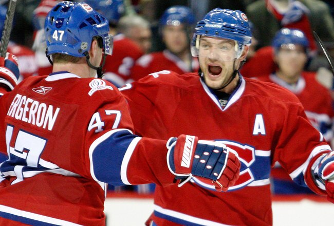 MONTREAL- APRIL 10:  Andrei Markov #79 celebrates the second period goal by Marc-Andre Bergeron #47 of the Montreal Canadiens during the NHL game against the Toronto Maple Leafs on April 10, 2010 at the Bell Centre in Montreal, Quebec, Canada.  (Photo by Richard Wolowicz/Getty Images)