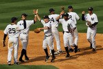 NEW YORK - APRIL 13:  The New York Yankees celebrate after defeating the Los Angeles Angels of Anaheim to winn their home opener at Yankee Stadium on April 13, 2010 in the Bronx borough of New York City.  (Photo by Chris McGrath/Getty Images)