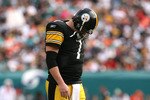 MIAMI - JANUARY 03:  Quarterback Ben Roethlisberger #7 of the Pittsburgh Steelers walks back to the huddle after injuring his shoulder in the fourth quarter against the Miami Dolphins at Land Shark Stadium on January 3, 2010 in Miami, Florida. The Steelers defeated the Dolphins 30-24.  (Photo by Doug Benc/Getty Images)
