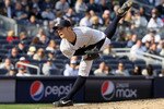 NEW YORK - APRIL 13:  David Robertson #30 of the New York Yankees throws a pitch against the Los Angeles Angels of Anaheim during the Yankees home opener at Yankee Stadium on April 13, 2010 in the Bronx borough of New York City.  (Photo by Jim McIsaac/Getty Images)