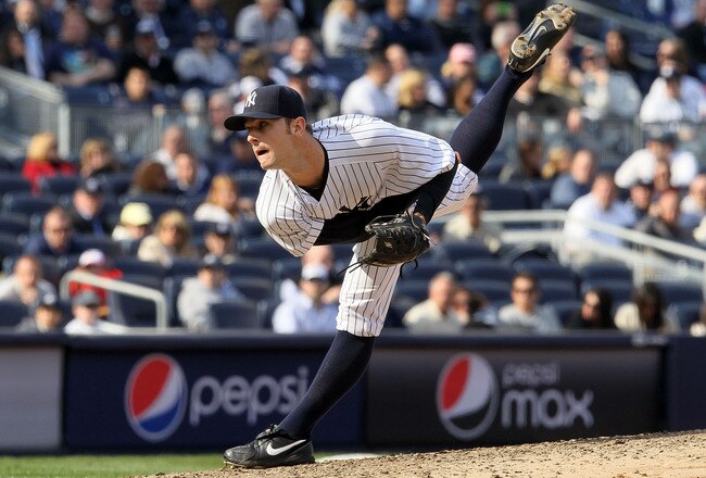 NEW YORK - APRIL 13:  David Robertson #30 of the New York Yankees throws a pitch against the Los Angeles Angels of Anaheim during the Yankees home opener at Yankee Stadium on April 13, 2010 in the Bronx borough of New York City.  (Photo by Jim McIsaac/Getty Images)