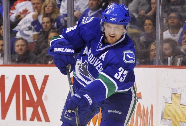 VANCOUVER, CANADA - APRIL 4: Henrik Sedin #33 of the Vancouver Canucks makes a pass during the NHL game against the Minnesota Wild on April 04, 2010 at General Motors Place in Vancouver, British Columbia, Canada.  (Photo by Rich Lam/Getty Images)