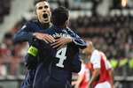 ALKMAAR, NETHERLANDS - OCTOBER 20: Cesc Fabregas of Arsenal celebrates with Robin van Persie after scoring the first goal during the UEFA Champions League Group H match between AZ Alkmaar and Arsenal at the DSB Stadium on October 20, 2009 in Alkmaar, Netherlands.  (Photo by Michael Regan/Getty Images)