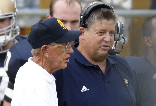 SOUTH BEND, IN - SEPTEMBER 13: Former head coach Lou Holtz of the Notre Dame Fighting Irish talks to current head coach Charlie Weis prior to playing the Michigan Wolverines on September 13, 2008 at Notre Dame Stadium in South Bend, Indiana.  (Photo by Gregory Shamus/Getty Images)