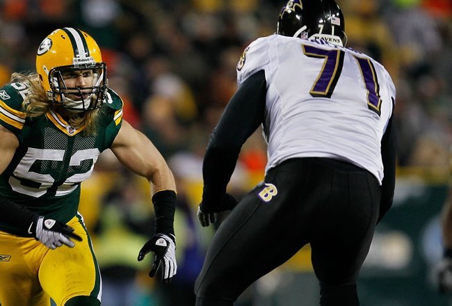 GREEN BAY, WI - DECEMBER 07: Clay Matthews #52 of the Green Bay Packers rushes against Jared Gaither #71 of the Baltimore Ravens at Lambeau Field on December 7, 2009 in Green Bay, Wisconsin. The Packers defeated the Ravens 27-17. (Photo by Jonathan Daniel/Getty Images)