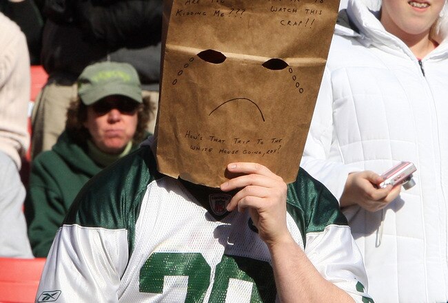 EAST RUTHERFORD, NJ - NOVEMBER 29:  A fan the New York Jets wears a paper bag on his had at the start of the game against the Carolina Panthers on November 29, 2009 at Giants Stadium in East Rutherford, New Jersey.  (Photo by Jim McIsaac/Getty Images)