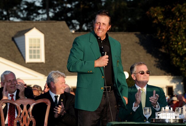AUGUSTA, GA - APRIL 11:  Phil Mickelson speaks to the gallery as Augusta National Chairman William Porter 'Billy' Payne (R) looks on during the green jacket presentation after the final round of the 2010 Masters Tournament at Augusta National Golf Club on April 11, 2010 in Augusta, Georgia.  (Photo by Harry How/Getty Images)