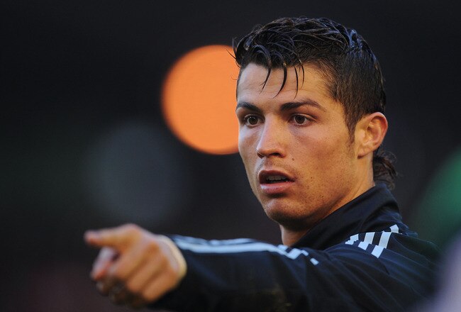 SANTANDER, SPAIN - APRIL 04:  Cristiano Ronaldo of Real Madrid points to the corner flag during the La Liga match between Racing Santander and Real Madrid at El Sardinero stadium on April 4, 2010 in Santander, Spain.  (Photo by Denis Doyle/Getty Images)