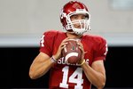ARLINGTON, TX - SEPTEMBER 05:  Quarterback Sam Bradford #14 of the Oklahoma Sooners warms up before a game against the Brigham Young Cougars at Cowboys Stadium on September 5, 2009 in Arlington, Texas.  (Photo by Ronald Martinez/Getty Images)
