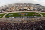 FORT WORTH, TX - NOVEMBER 08:  Jeff Gordon, driver of the #24 DuPont Chevrolet, and Kurt Busch, driver of the #2 Miller Lite Dodge, lead the field to a restart in the NASCAR Sprint Cup Series Dickies 500 at Texas Motor Speedway on November 8, 2009 in Fort Worth, Texas.  (Photo by Chris Graythen/Getty Images)