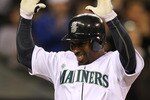 SEATTLE - APRIL 14:  Chone Figgins #9 of the Seattle Mariners reacts after crossing home plate in the fifth inning against the Oakland Athletics at Safeco Field on April 14, 2010 in Seattle, Washington. (Photo by Otto Greule Jr/Getty Images)