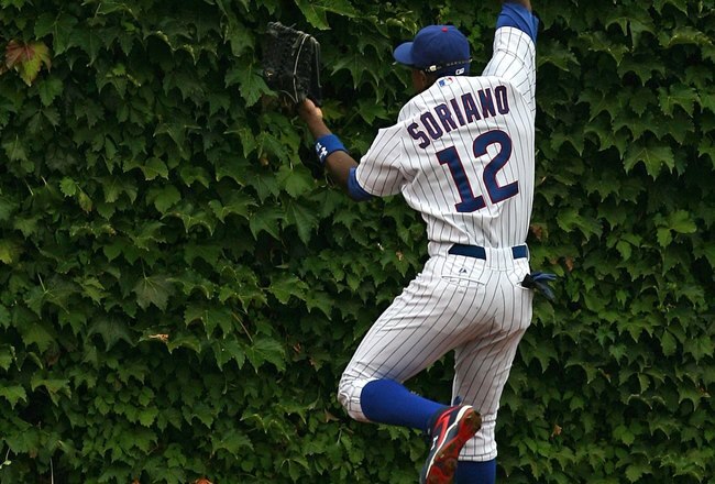 CHICAGO - AUGUST 28: Alfonso Soriano #12 of the Chicago Cubs misses a catch in the outfield against the New York Mets on August 28, 2009 at Wrigley Field in Chicago, Illinois. The Cubs defeated the Mets 5-2. (Photo by Jonathan Daniel/Getty Images) 