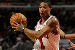 CHICAGO - MARCH 30: Derrick Rose #1 of the Chicago Bulls looks to pass against the Phoenix Suns at the United Center on March 30, 2010 in Chicago, Illinois. The Suns defeated the Bulls 111-105. NOTE TO USER: User expressly acknowledges and agrees that, by downloading and/or using this Photograph, User is consenting to the terms and conditions of the Getty Images License Agreement. (Photo by Jonathan Daniel/Getty Images)